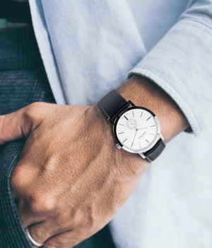 Man wearing watch - Fjordson watch with white dial and black vegan leather watch strap - UNISEX - vegan & approved by PETA - Swiss made